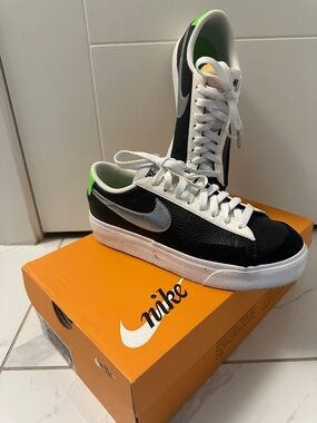 Nike Black/White Low-Top Sneakers with Silver Swoosh and Neon Green Heel